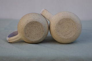 Pair of large pink-flecked tea cups or coffee mugs with handle (sample)
