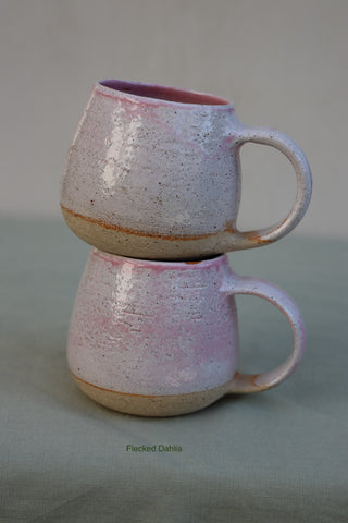 Pair of large pink-flecked tea cups or coffee mugs with handle (sample)