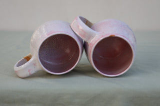 Pair of large pink-flecked tea cups or coffee mugs with handle (sample)