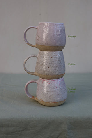 Pair of large pink-flecked tea cups or coffee mugs with handle (sample)