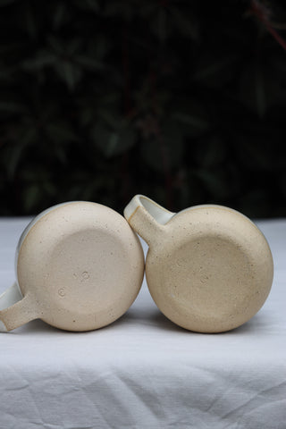 Pair of standard tea cups or coffee mugs with handle in arctic