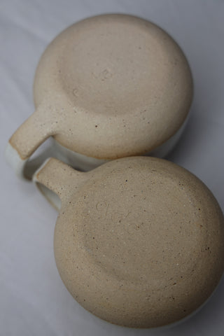 Pair of standard tea cups or coffee mugs with handle in arctic