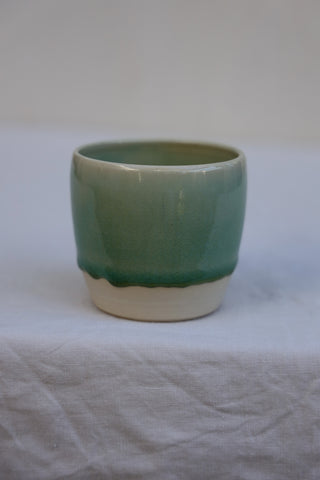 Latte cup in ocean