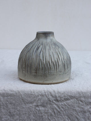 Carved vase in grey