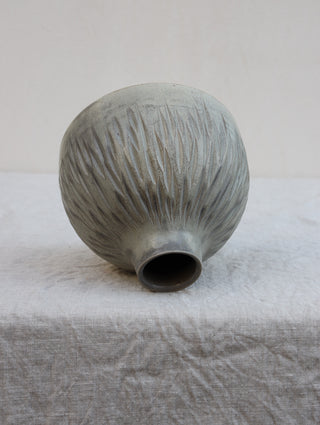 Carved vase in grey