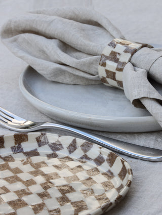 Set of four Chickedey-Checkedey plates with matching napkin rings