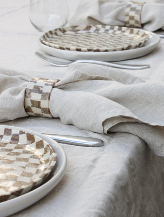 Set of four Chickedey-Checkedey plates with matching napkin rings