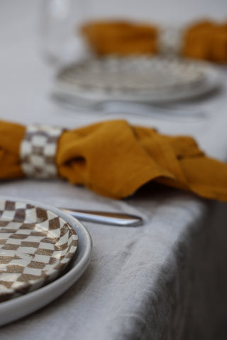 Set of four Chickedey-Checkedey plates with matching napkin rings