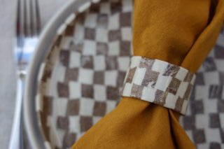 Set of four Chickedey-Checkedey plates with matching napkin rings