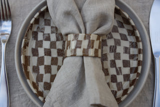 Set of four Chickedey-Checkedey plates with matching napkin rings