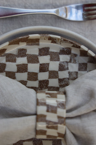 Set of four Chickedey-Checkedey plates with matching napkin rings