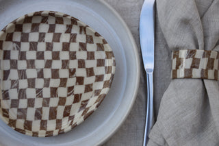 Set of four Chickedey-Checkedey plates with matching napkin rings
