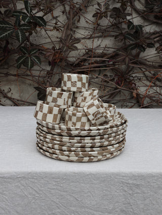Set of four Chickedey-Checkedey plates with matching napkin rings