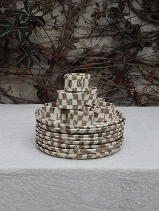 Set of four Chickedey-Checkedey plates with matching napkin rings