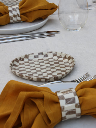 Set of four Chickedey-Checkedey plates with matching napkin rings