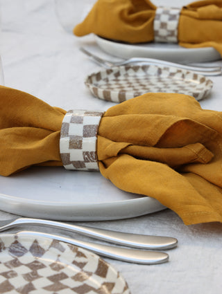 Set of four Chickedey-Checkedey plates with matching napkin rings