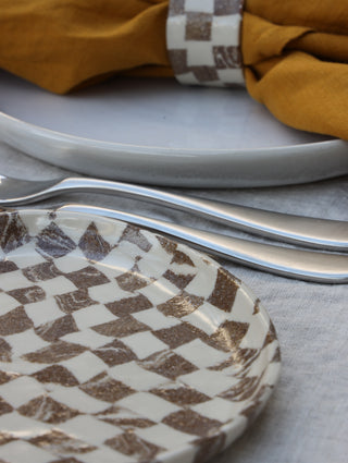 Set of four Chickedey-Checkedey plates with matching napkin rings