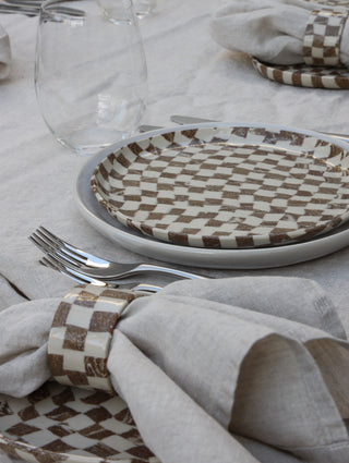 Set of four Chickedey-Checkedey plates with matching napkin rings