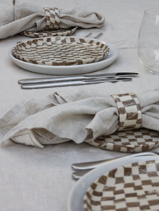 Set of four Chickedey-Checkedey plates with matching napkin rings