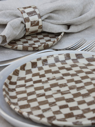Set of four Chickedey-Checkedey plates with matching napkin rings