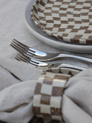 Set of four Chickedey-Checkedey plates with matching napkin rings
