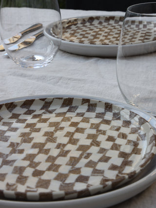 Set of four Chickedey-Checkedey plates with matching napkin rings