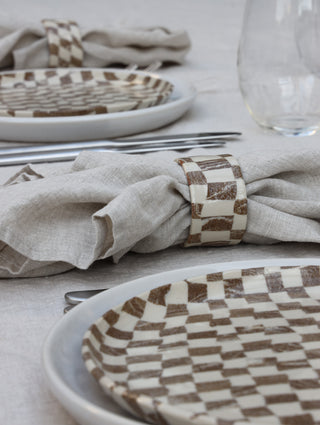 Set of four Chickedey-Checkedey plates with matching napkin rings