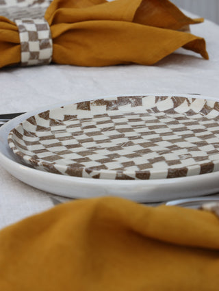 Set of four Chickedey-Checkedey plates with matching napkin rings