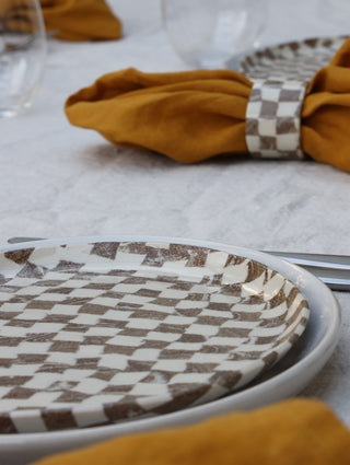 Set of four Chickedey-Checkedey plates with matching napkin rings