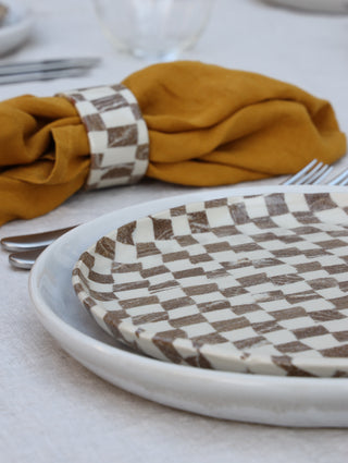 Set of four Chickedey-Checkedey plates with matching napkin rings