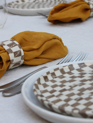 Set of four Chickedey-Checkedey plates with matching napkin rings